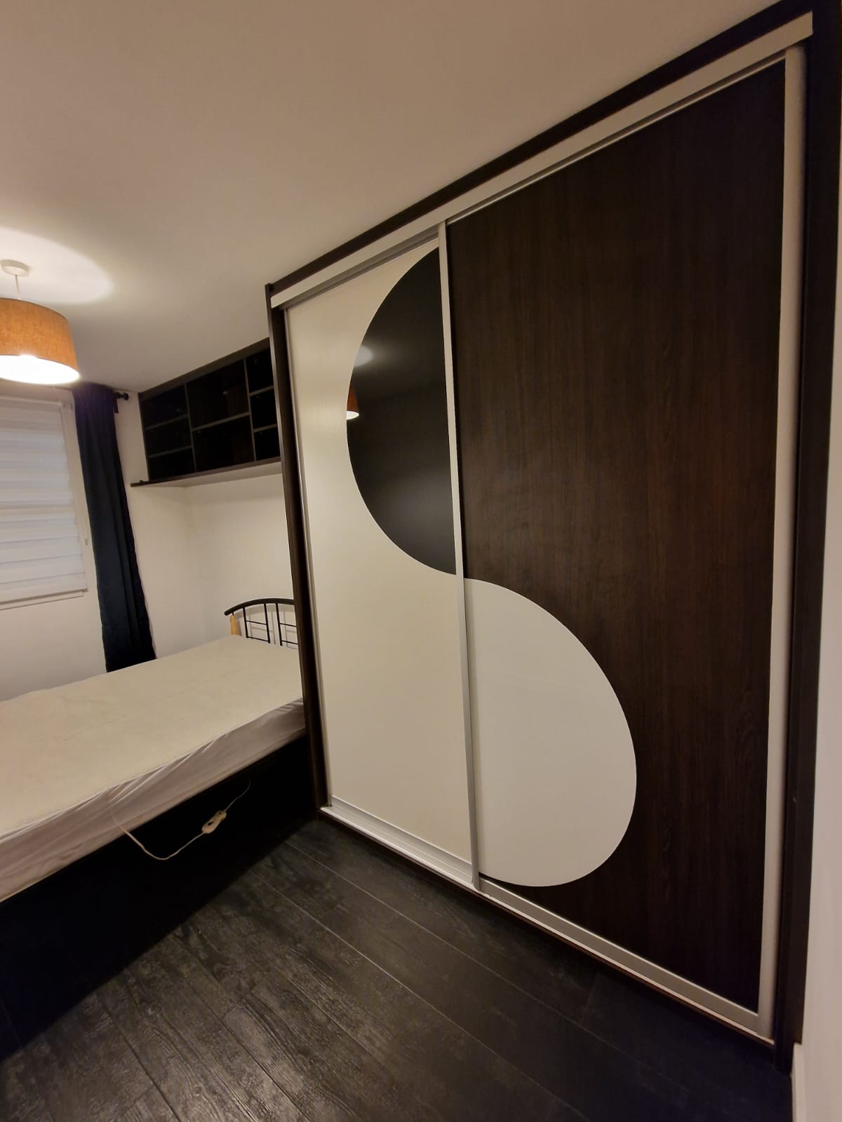 Bedroom 1 fitted wardrobes with the sliding doors closed