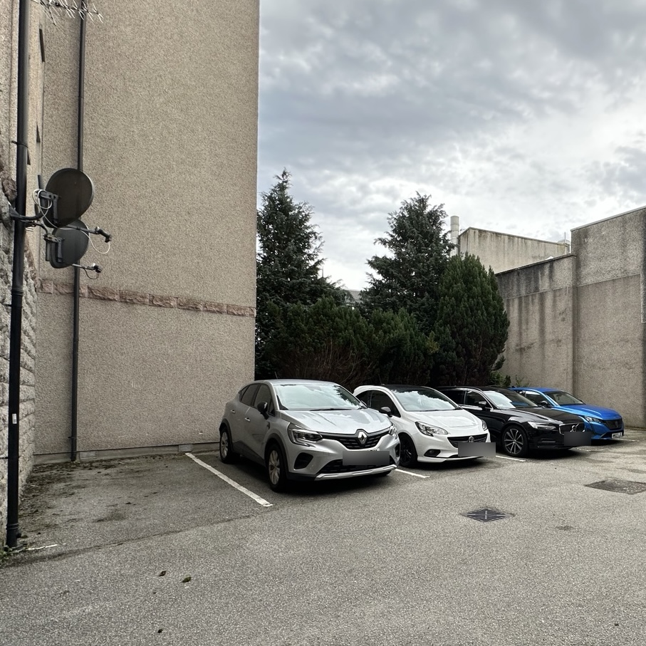 A second view across the shared off-street courtyard car park