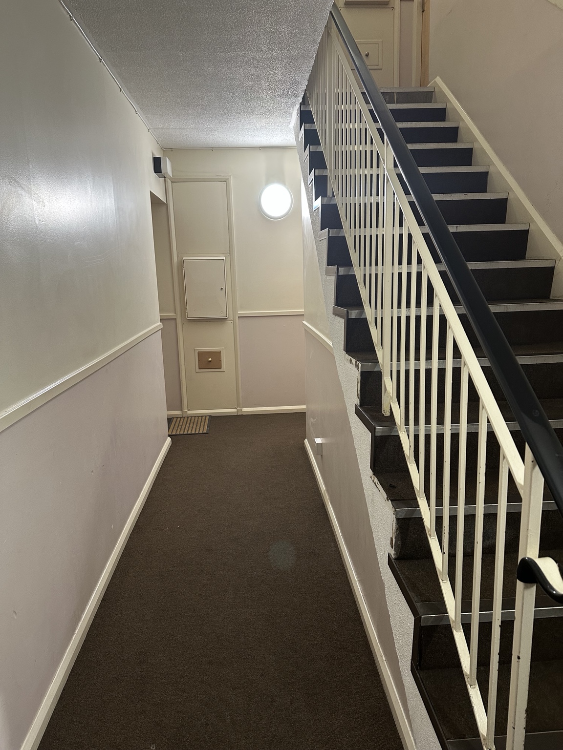 Shared entrance hallway beside the stairs